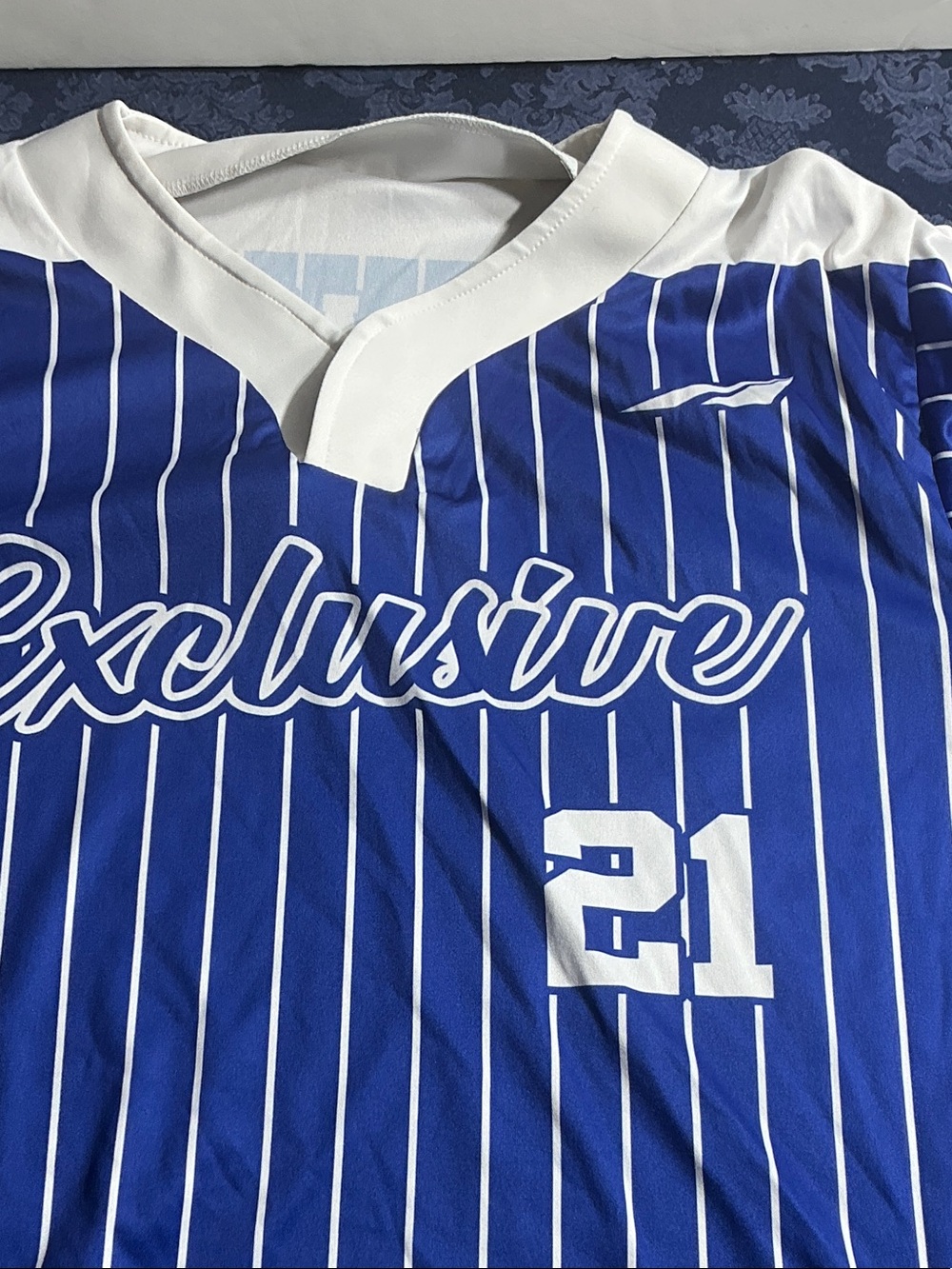 Blue and white black star athletes jersey